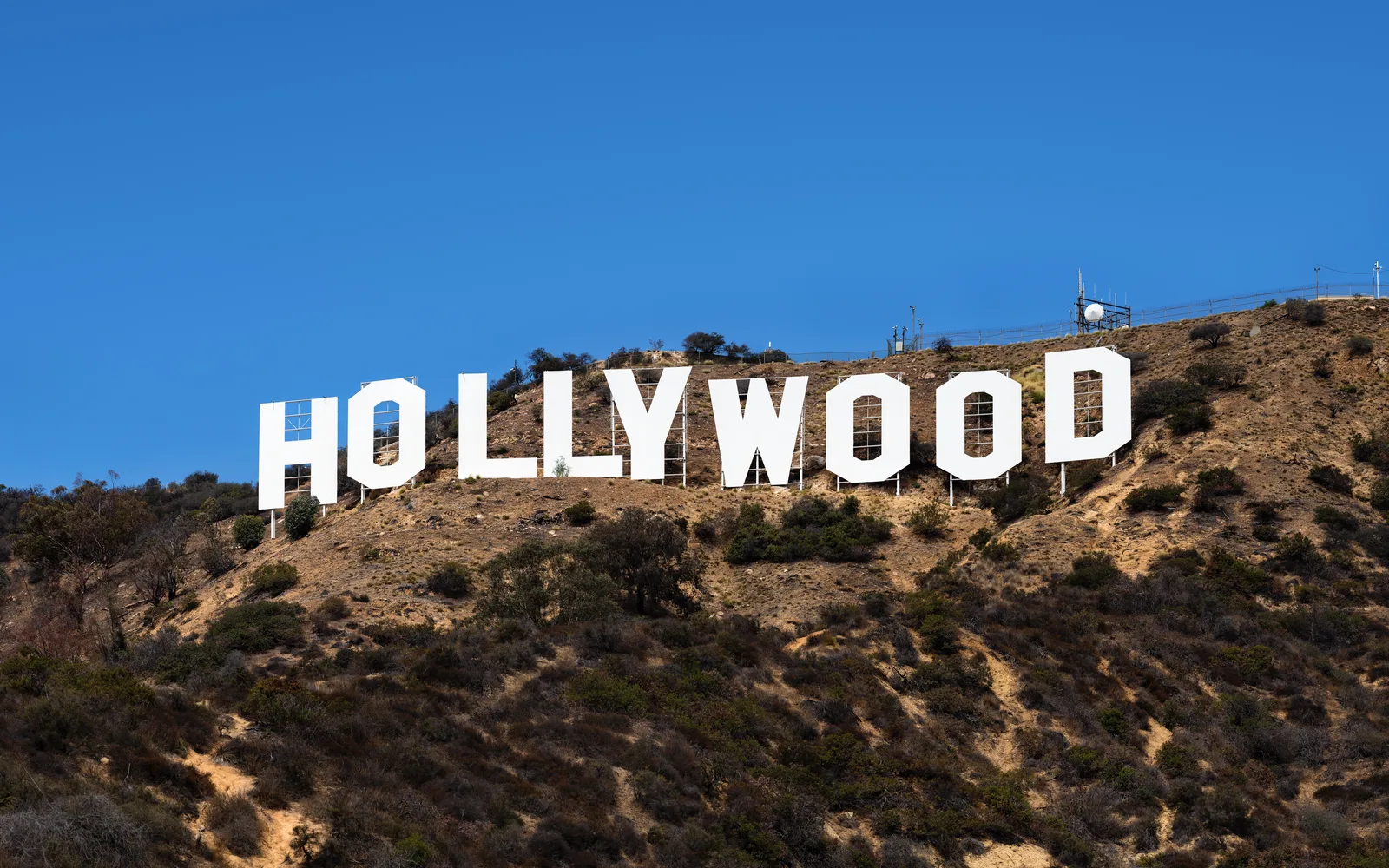 The Hollywood Sign on a hillside overlooking Los Angeles